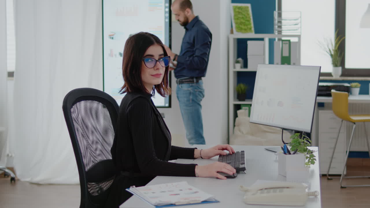 Businesswoman working on marketing strategy with charts