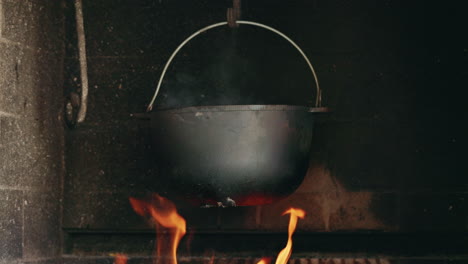 hanging pot over fireplace