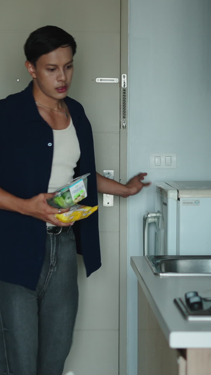 Man looking into a Toshiba refrigerator