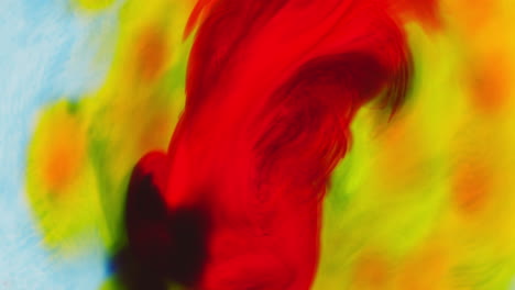 pintura o tinte azul y naranja caído en el agua contra un fondo blanco para crear un fondo de humo de colores giratorios 1