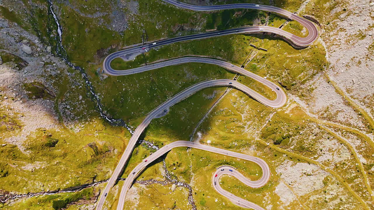 Top view of Transfagarasan mountain pass with sharp turns. Steep serpentine turns of Transfagarasan road in Romania
