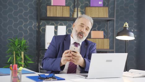 dancing happy businessman using phone.
