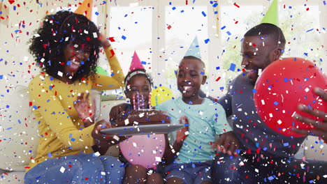 confetti animation over family celebrating birthday with cake and balloons