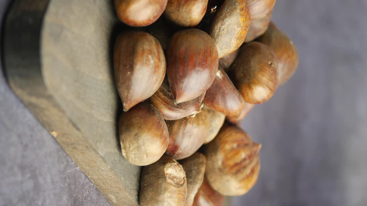 Chestnuts on a Wooden Board