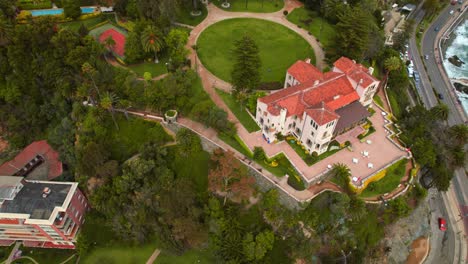 cerro castillo presidential palace surrounded by greenery in vina del mar chile, aerial view