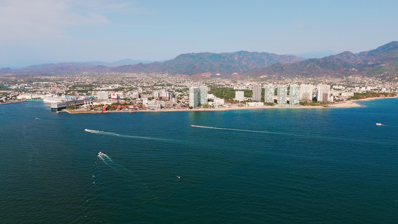 View from the sea towards the hotel zone in puerto vallarta, pacific ocean coastline in mexico