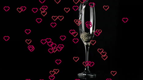 champagne glass with bubbles over falling hearts animation on black background