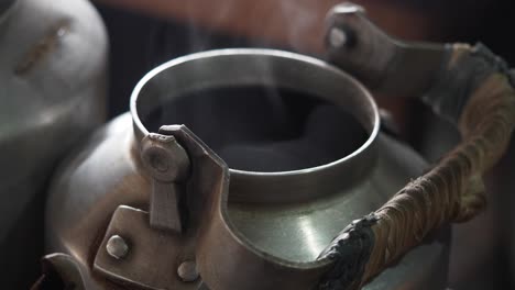 vintage metal kettle with steam