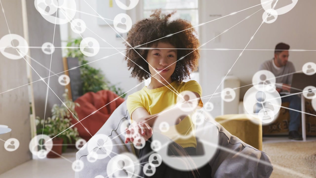 Woman on beanbag reaching toward network icons starting near chest, connecting social network