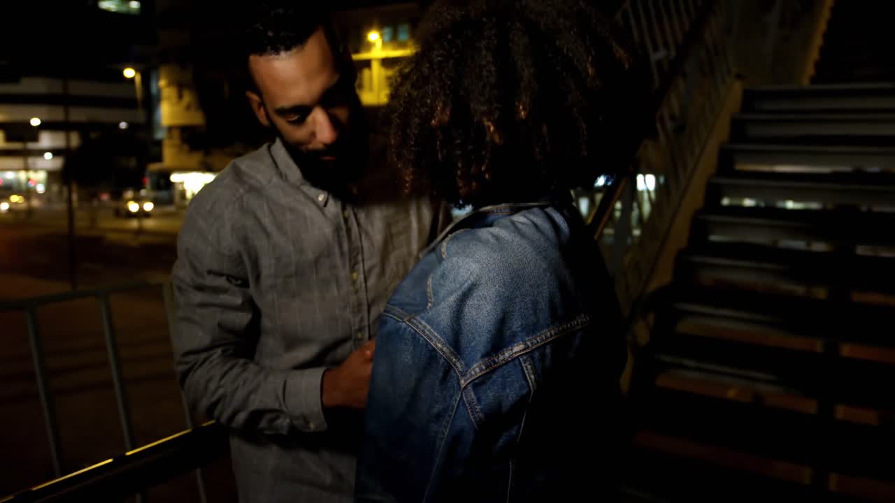 Couple interacting with each other in city street 4k