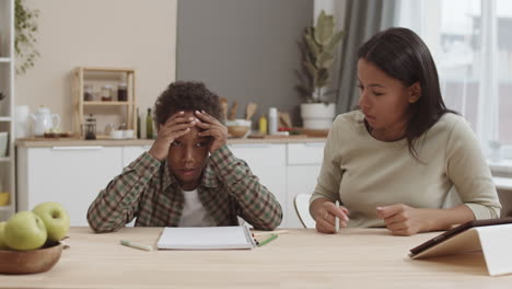 mother helping her son with homework