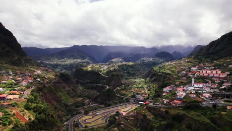 aerial panorama of town in volcanic green mountain valley landscape, madeira