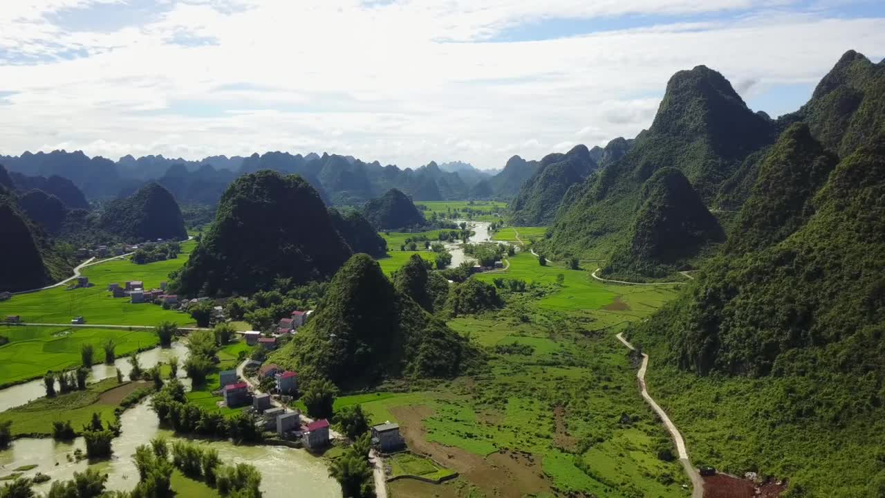 Aerial view of Ban Gioc Waterfalls amid lush green landscape
