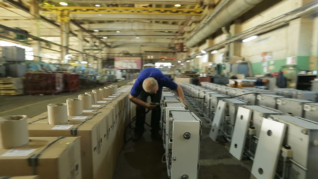 Worker In The Factory. BAR, UKRAINE - AUGUST 2017: View of male worker works in a factory