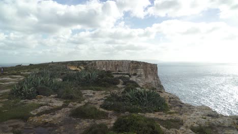 Ta-Cenc-Cliffs-on-Cloudy-Winter-Day-near-Blue-Mediterranean-Sea