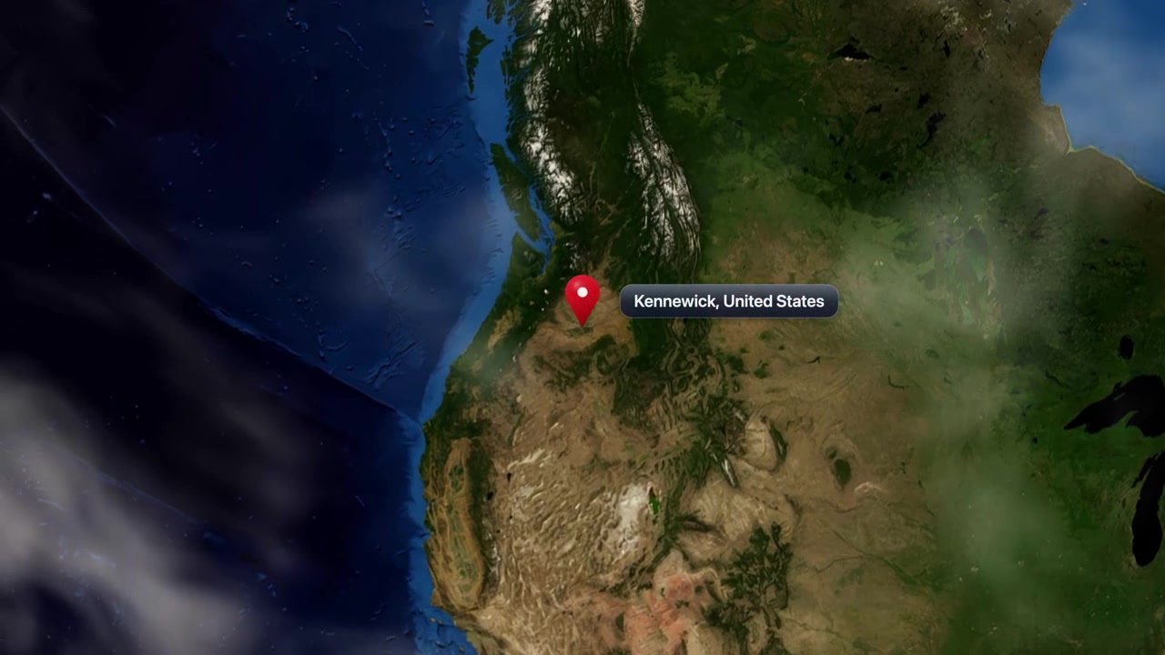 Satellite view zooms from realistic spinning globe down to Kennewick, Washington, United States marker pin. Includes NASA public domain imagery.
