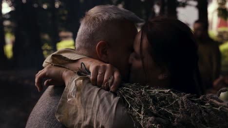 couple in a forest hug