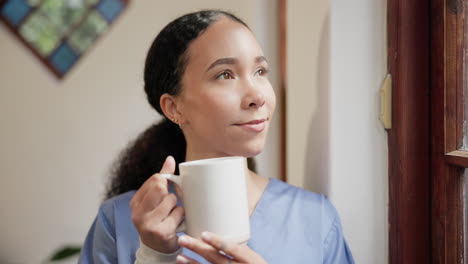 Nurse,-thinking-and-happy-to-relax-with-coffee