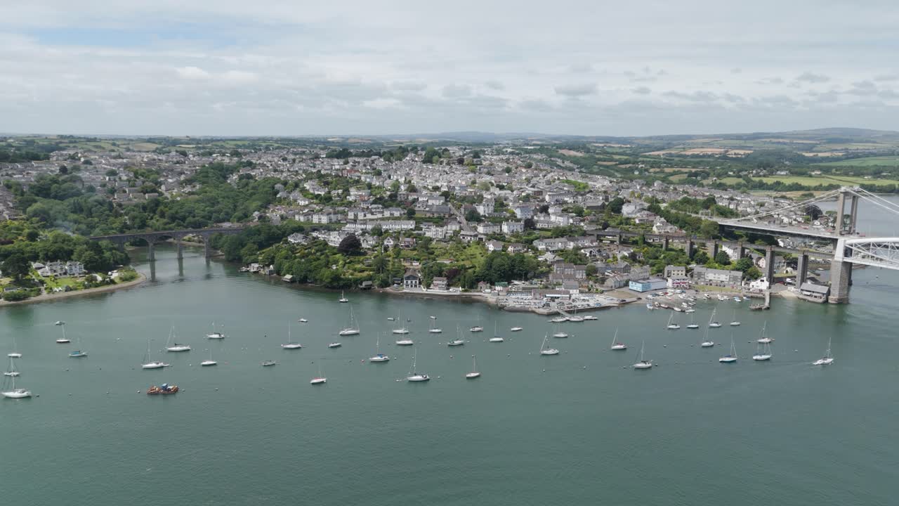 Aerial View of a Coastal Town with Bridges and Boats on the Water