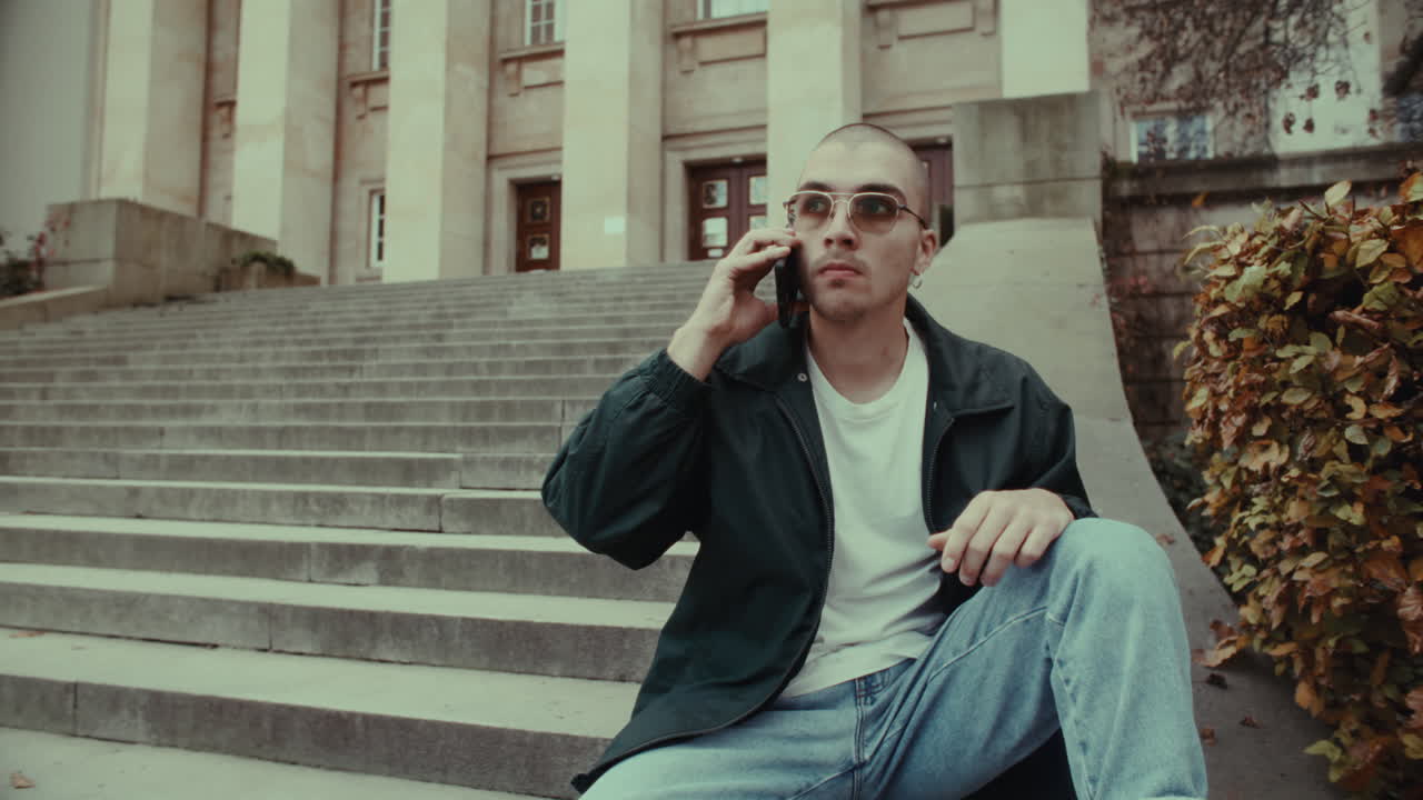 Young man on the phone outdoors