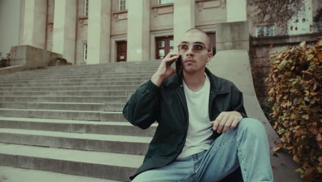 young man on the phone outdoors