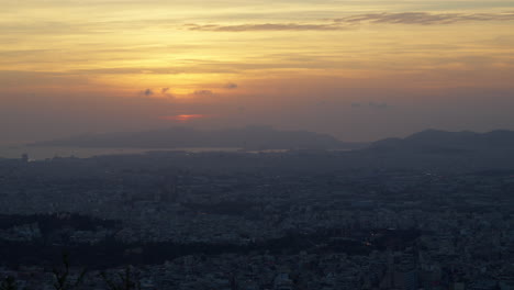 athenian skyline at dusk with golden sky