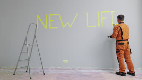 renovation project: painting a wall with new life inscription