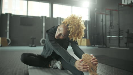 woman stretching at the gym