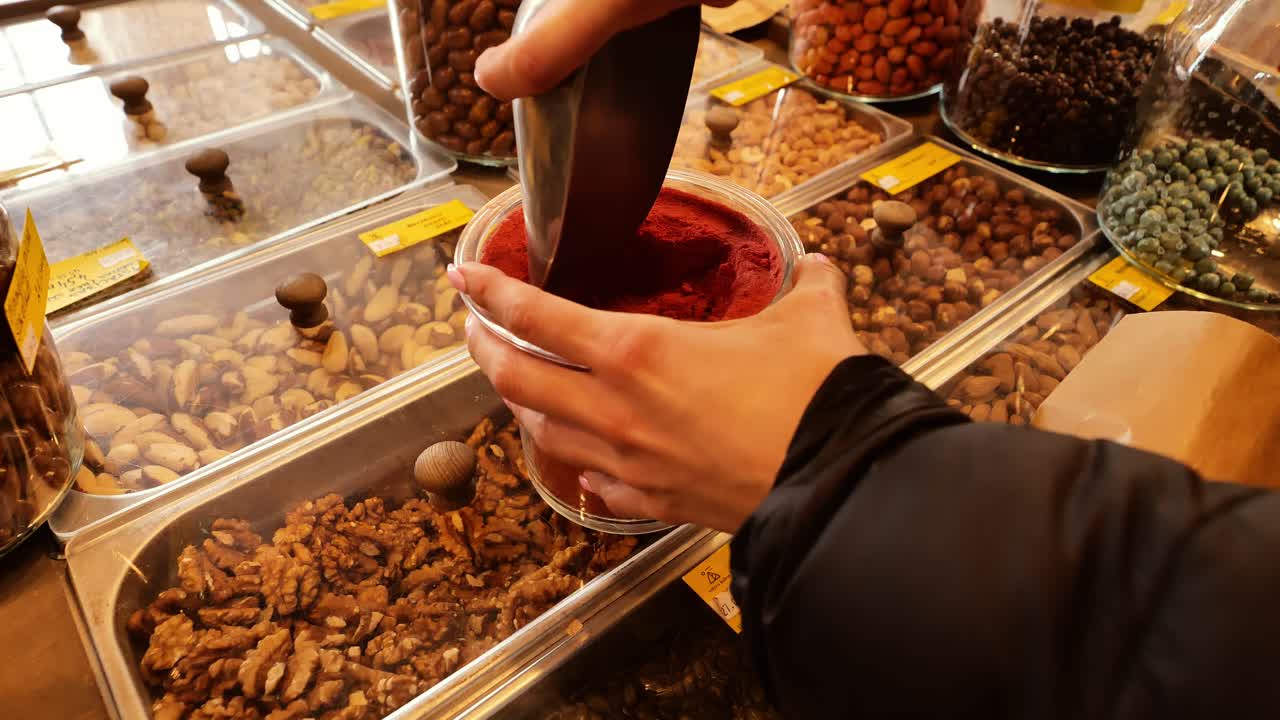 Zero-waste store features refill station with fruits, nuts, and berry powder