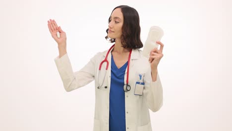 Female Doctor Demonstrating Menstrual Hygiene Products