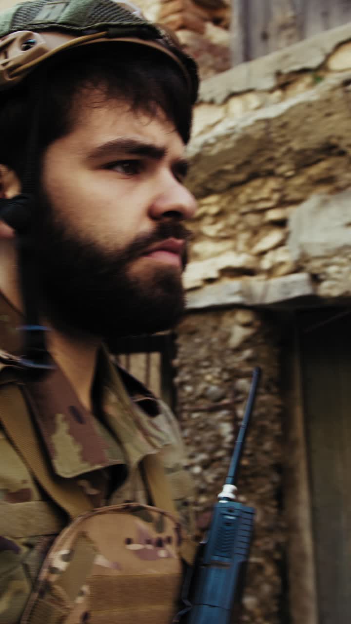 Soldier Walks In A War Destroyed Village Houses