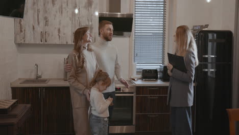 happy family with the keys of their new house