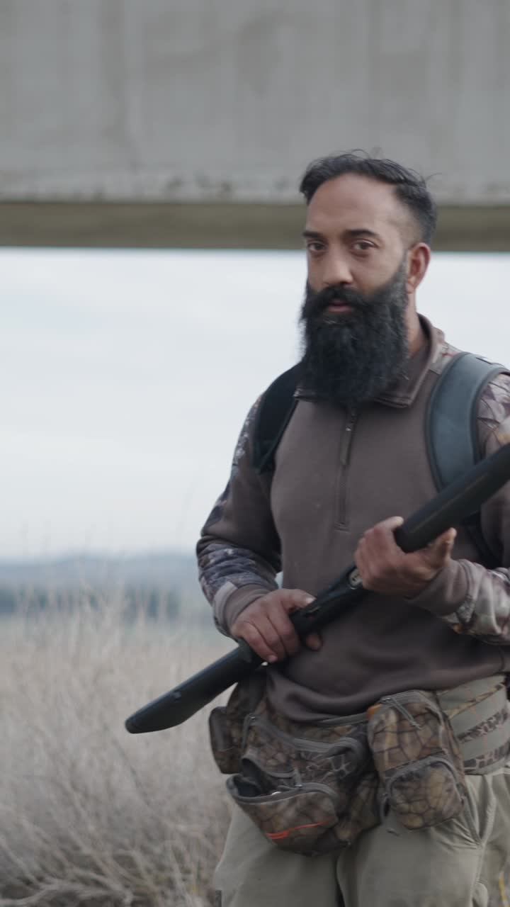 Hunter with shotgun outdoors