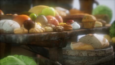 food table with wine barrels and some fruits, vegetables and bread