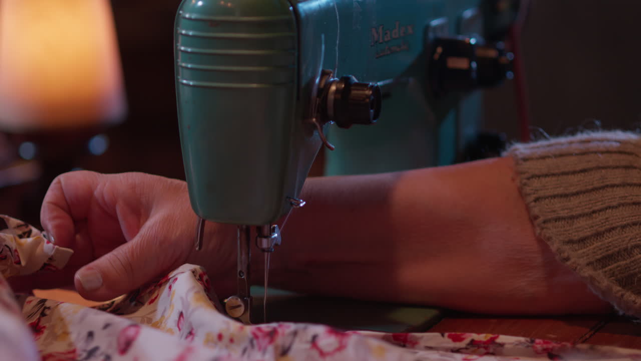 Close Up of Hands Sewing Fabric on a Vintage Sewing Machine