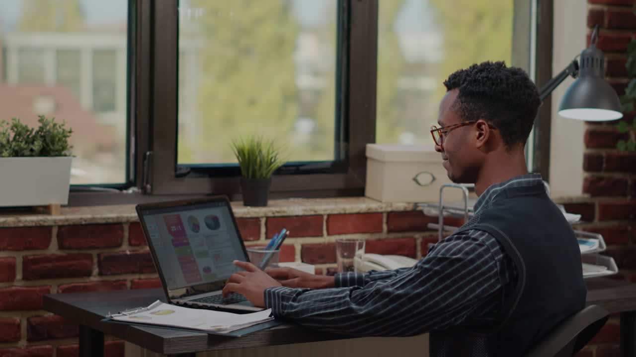 Financial consultant using laptop to work on business growth