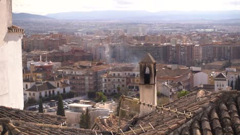 Chimney-with-smoke-exiting-with-European-city-panorama