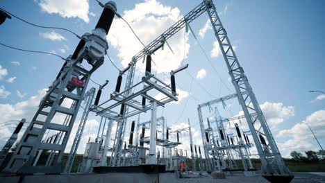 high voltage transformer against the blue sky. electric current redistribution substation