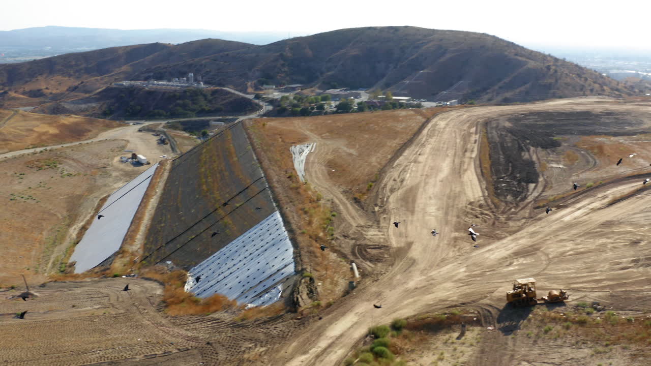 Aerial View of Landfill Site with Birds