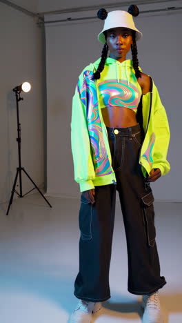 fashion model in neon green jacket and cargo pants