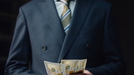 Business-man-counting-cash-hundreds-dollars-close-up.-Manager-calculating-profit