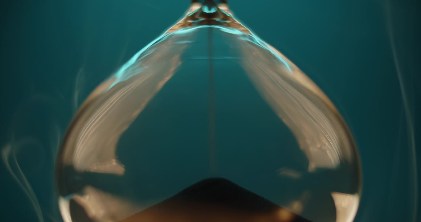 Smoke slowly wraps turquoise hourglass