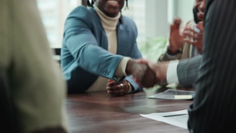 business handshake during a successful meeting