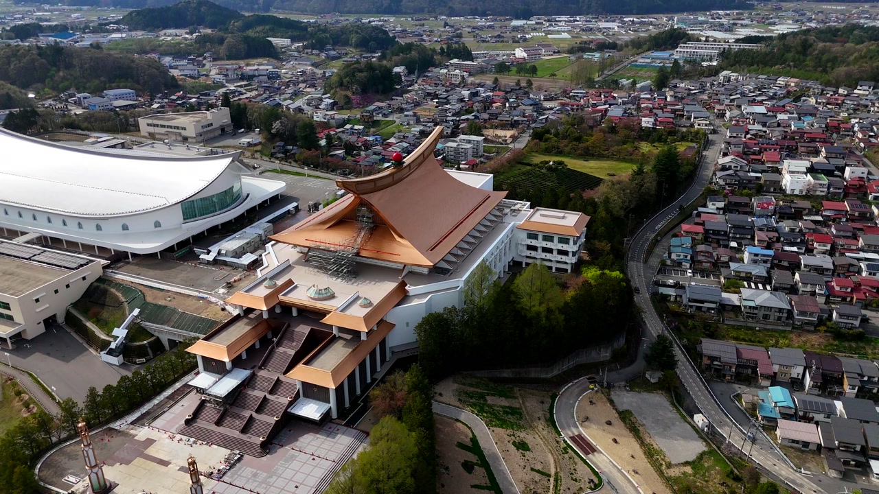 Takayama, Japan, Drone shot of Sukyo Mahikari Shrine buildings rotating