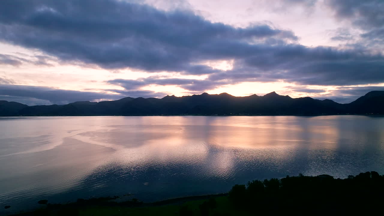 Dramatic Sunset Silhouetted Vesteralen Mountains and Deep Blue Cloudy Sky in Northern Norway