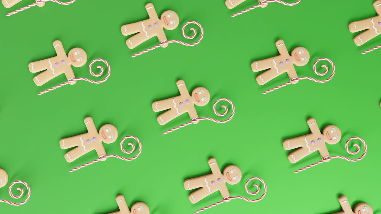hombres de pan de jengibre y bastones de caramelo en un fondo verde vertical