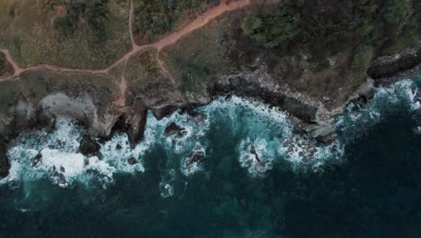 Aerial-bird's-eye-view-of-the-scenic-Mazunte-beach-in-the-oaxacan-coast-in-Mexico-on-a-cloudy-day