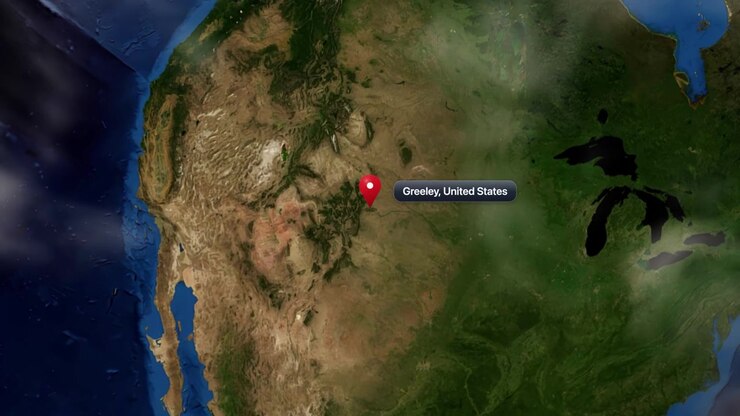 Satellite view camera zooms in from space to Greeley, United States, marked with pin. Includes NASA public domain imagery.