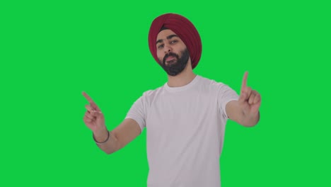 happy sikh indian man dancing and doing bhangra green screen