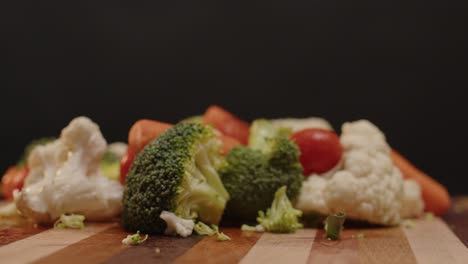 vegetables are spinning on a cutting board with